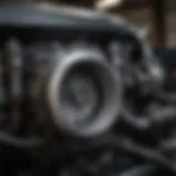 A close-up of a Toyota car's engine compartment being inspected for wear and tear.