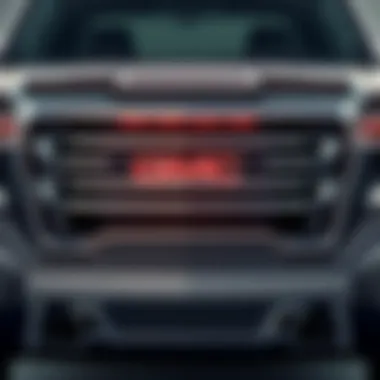 Front view of a GMC Sierra highlighting its bold grille and design