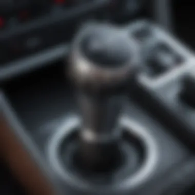 A detailed view of a manual transmission gear stick inside a car